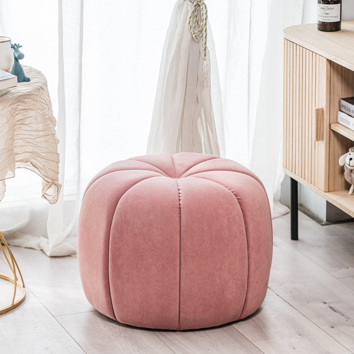 Pouf en velours rose avec rayures